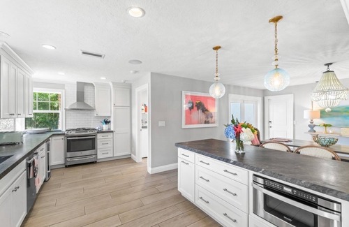 Lake Ida Shores Casa | Diseñador renovado paraíso tropical en el lago Ida Delray Beach W / piscina climatizada