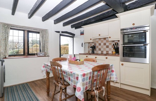 Yarcombe Cabaña | RED ROOF, pet friendly, with open fire in Combe St Nicholas