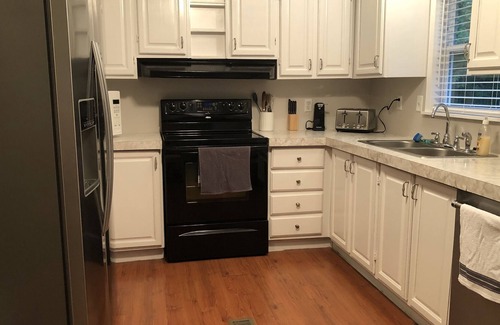 Maryville Casa | Relax while listening to a Natural Waterfall from your Private Park!