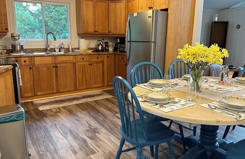 Georgian Bay Cabaña | Renovated water front cottage w/firepit, multi level decks & screened in porch.