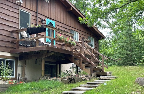 Georgian Bay Cabaña | Renovated water front cottage w/firepit, multi level decks & screened in porch.