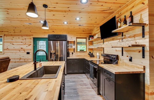 Newaygo Cabina | Relax at River's Edge: Stunning Views, Hot Tub, Pet-Friendly!