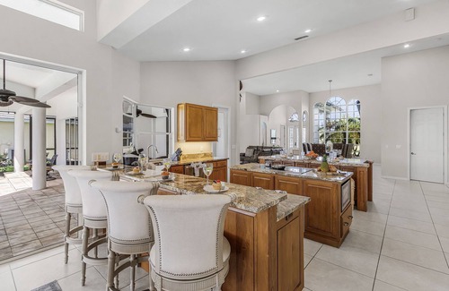 Pelican Casa | Riverfront Luxury with Heated Pool, Spa & Private Dock – Sunny Shores Escape