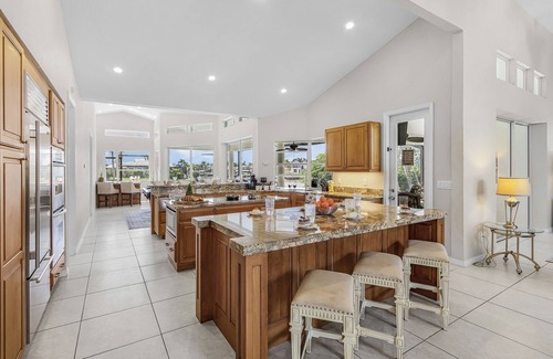 Pelican Casa | Riverfront Luxury with Heated Pool, Spa & Private Dock – Sunny Shores Escape