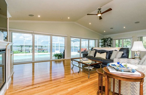 Van Valzah Casa | Riverside Retreat- 3/3 with pool, dock, grill 2 block walk to the beach!