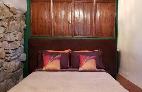 Cerrillos Casa | Romantic, Rock Carriage House, Hot Tub, Woodstove, Kitchen on Historic Property