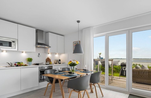 Olpenitz Apartamento | Sea view - 1st row on the water, terrace, ground floor, sauna, bathtub, electric grill