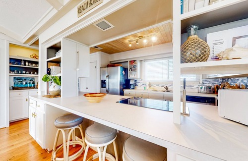Royal Lagoons Casa | Serene sound-front home with a covered patio, dock, and swing bed
