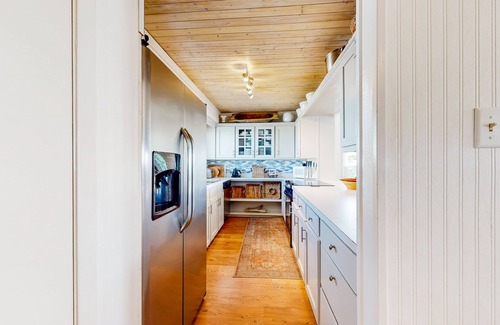 Royal Lagoons Casa | Serene sound-front home with a covered patio, dock, and swing bed