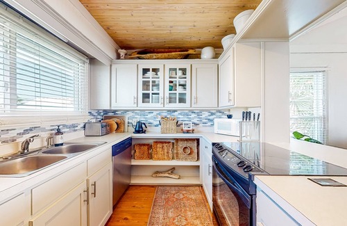 Royal Lagoons Casa | Serene sound-front home with a covered patio, dock, and swing bed