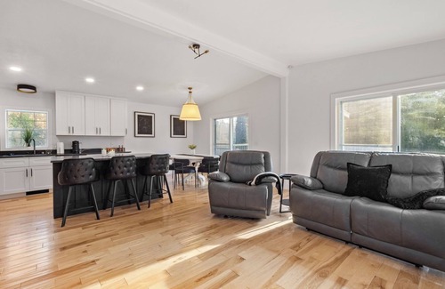 Rapid City Casa | Serene, Spacious Riverfront Home close to Torch Lake with lots of Entertainment