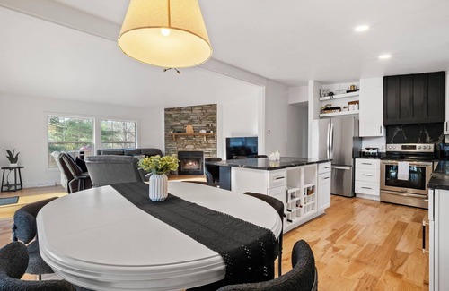 Rapid City Casa | Serene, Spacious Riverfront Home close to Torch Lake with lots of Entertainment