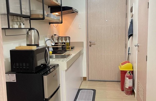 Novaliches Condominio | Spacious Comfort: Two bedrooms & large living space ideal for families friends