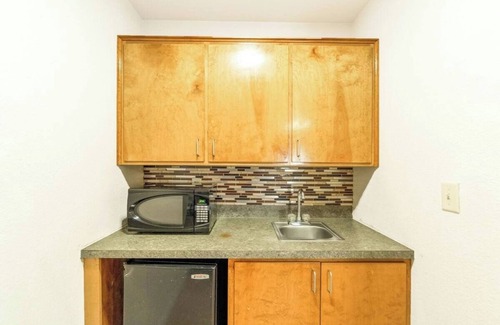 Killeen Hotel | Spacious Room w/ Fridge, Microwave & Private Bath – Ideal for Family Road Trips