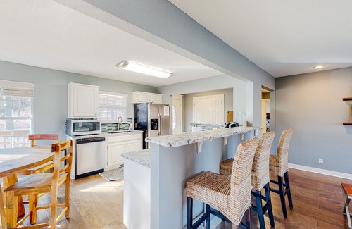 Garfield Casa | Spacious waterfront home with a washer/dryer, central AC & deck