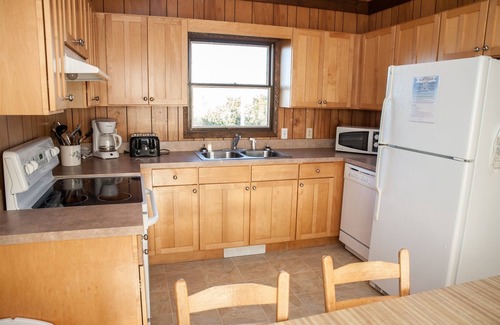 Frisco Cabaña | ¡Quédate en Sound Rider y ve en kayak por la puerta de atrás!