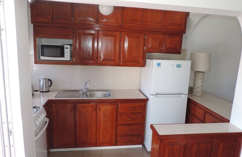 Dickenson Bay Villa | Impresionante apartamento junto a la playa en la hermosa bahía de Dickenson