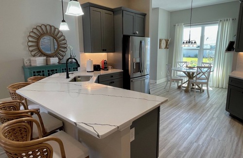 Sumter County Casa | Stunning new home with water view, screened lanai & golf cart!