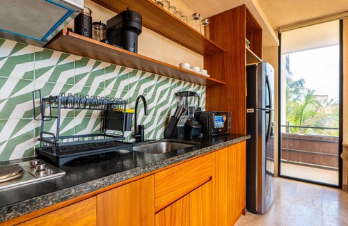 Tulsayab Condominio | Stylish condo with pool, breezy balcony & full kitchen near cenotes