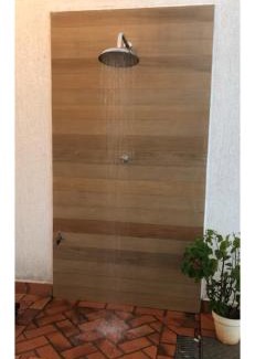 Goiania Casa | Suíte com janela para o jardim