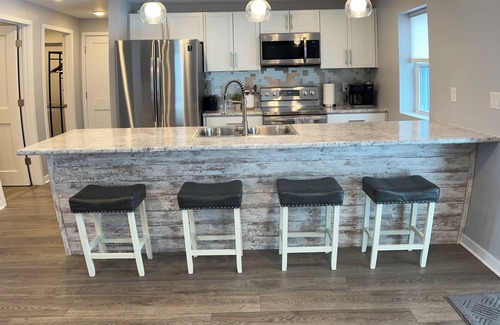 Oconto Casa | The Blue Riverside Home in Oconto