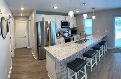 Oconto Casa | The Blue Riverside Home in Oconto