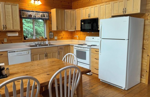 Columbia Falls Cabina | The Grizzly Cabin at Glacier Park is in the remote North Fork, Flathead River.