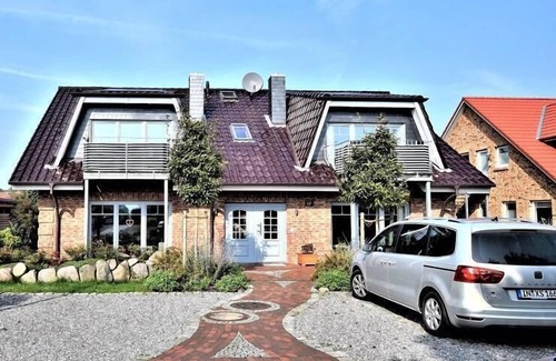 Hohwacht Apartamento | The house Ostseeliebe with 4 apartments is located in the new residential/holiday area Kra