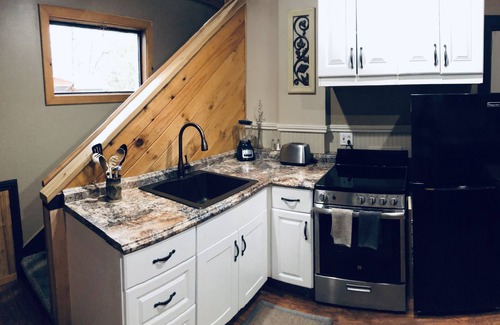 Weaverville Casa | The Loft King Room w/ full kitchen in historic Carriage House building.