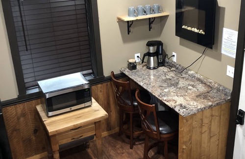 Weaverville Casa | The Loft King Room w/ full kitchen in historic Carriage House building.