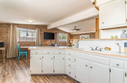 The Garden District Apartamento | This centrally located 1 bedroom features a full size pool and electric vehicle charging on site.