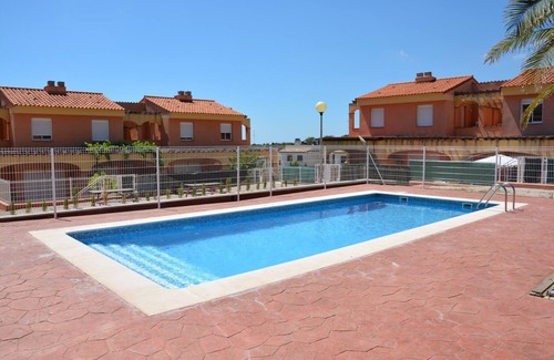 Miami Platja Casa | Casa adosada con jardín privado y piscina comunitaria en el Casalot, Miami Playa