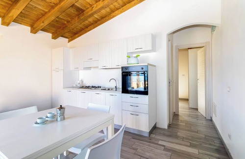 Paduledda Apartamento | Apartamento de vacaciones "Case Aquafan Mare" con vistas al mar, piscina y terraza