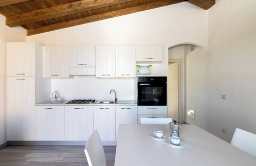 Paduledda Apartamento | Apartamento de vacaciones "Case Aquafan Mare" con vistas al mar, piscina y terraza