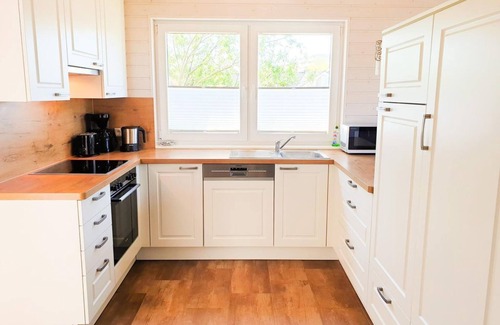 Schonberg Casa | Vacation home Ostseelodge - Holiday home with sauna, fireplace, garden house