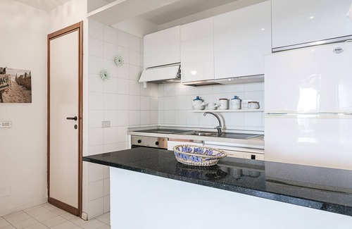 Portisco Casa | Casa Rena Bianca Flat con vistas al mar, terraza y jardín