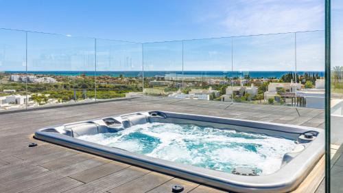 Nueva Milla de Oro Villa | VACATION MARBELLA I Villa Martinica, Turquoise Heated Pool, Rooftop Hot Tub with Sea View, Cine Room, 5 min to the Beach