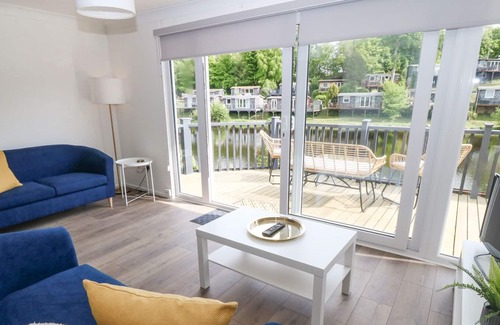 Bont Newydd Cabina | WATER'S EDGE, 44 GLAN GWNA, pet friendly, with a garden in Caernarfon