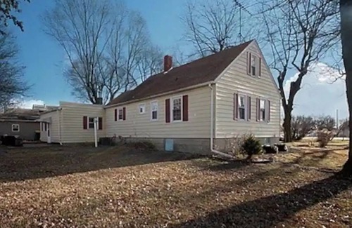 Coal City Casa | Yellow house near the railroad tracks in Coal City