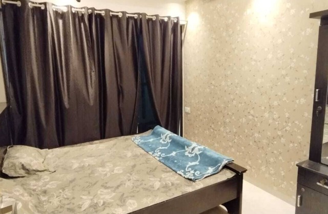 1BHK flat fully furnished bedroom, hallway with single bed balconies.