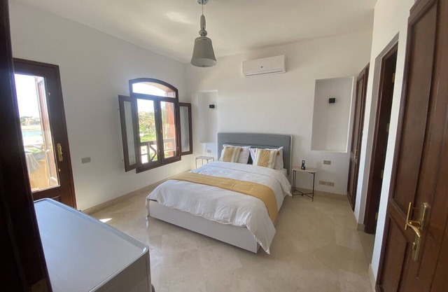 2 BR flat overlooking open lagoon and private pool