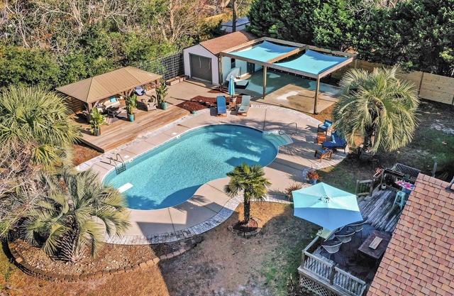 4 bedroom 3 bath with tranquil saltwater pool oasis! Sleeps up to 12