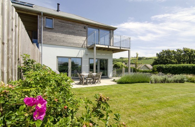 5 * acogedora casa de vacaciones que admite mascotas a pocos pasos de la playa.