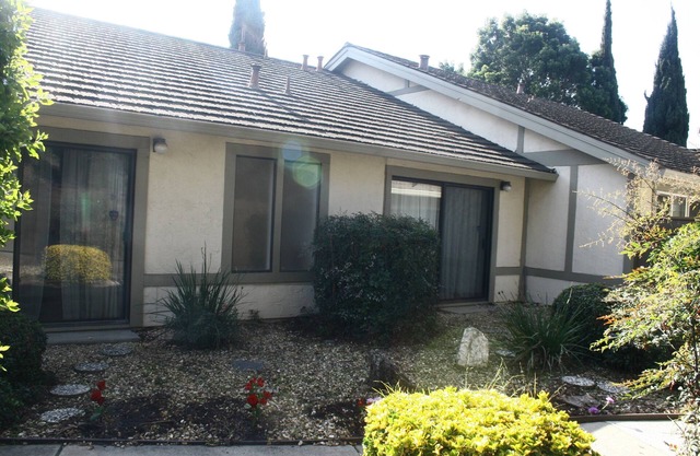 A personal oasis! A single story home in a resort with spacious rooms and yard !