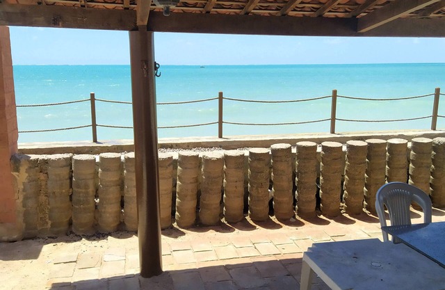 A private chale less than 20 feet from the ocean