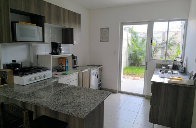 Alajuela Stay: Close to Airport, Viva Park & CAR with amenities like pool & gym