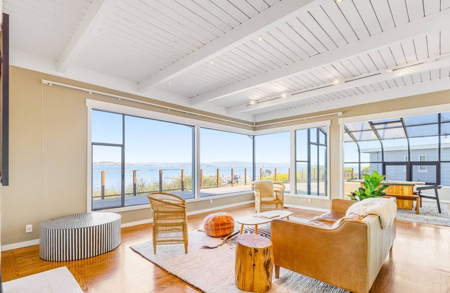 Amazing bay-view home with large deck, sunroom, & fireplace