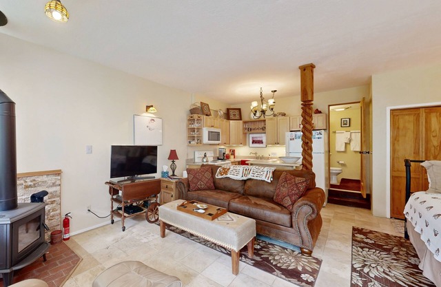 Amazing condo with river & mountain views, hot tub, & wood-burning fireplace