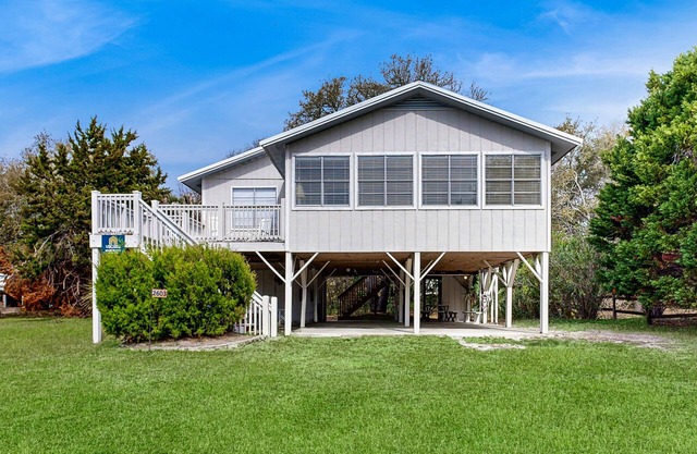 Beach home with huge lawn, open deck, covered patio & grill