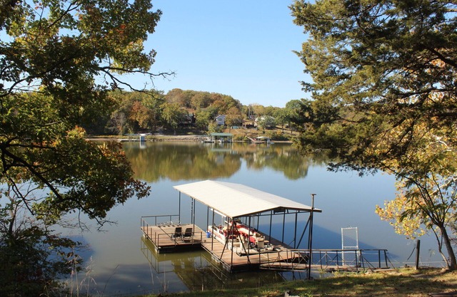 Beautiful waterfront house in Warsaw with swimming dock and boat slip